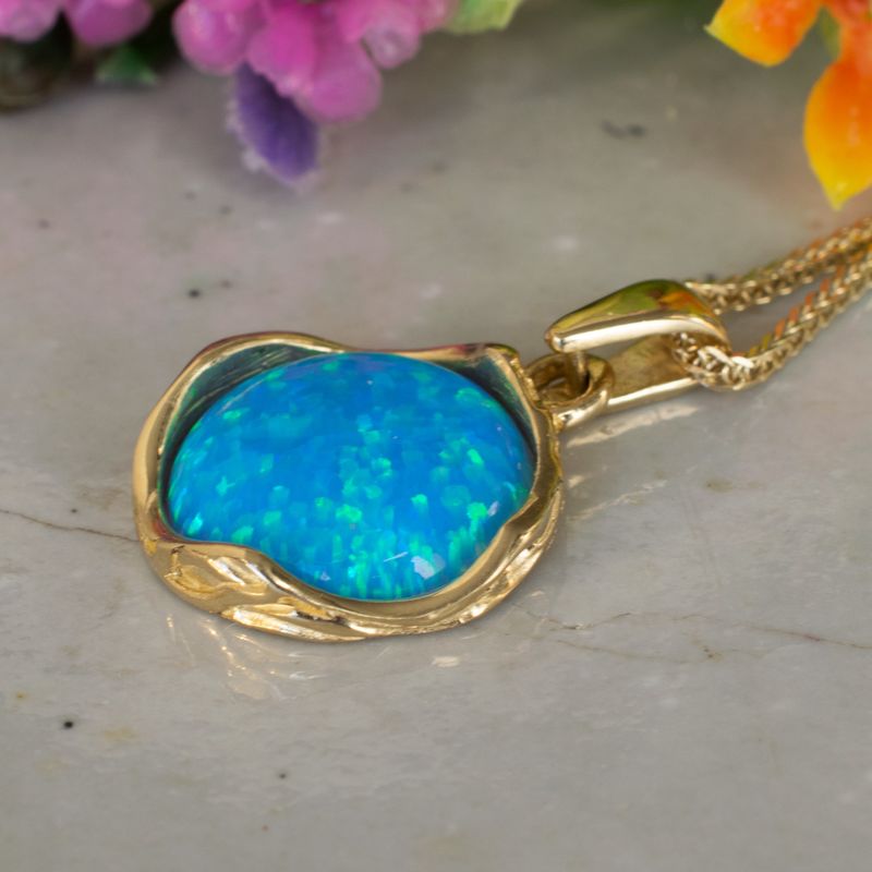 תליון מעוטר במסגרת זהב 14 קראט אבן אופל כחול