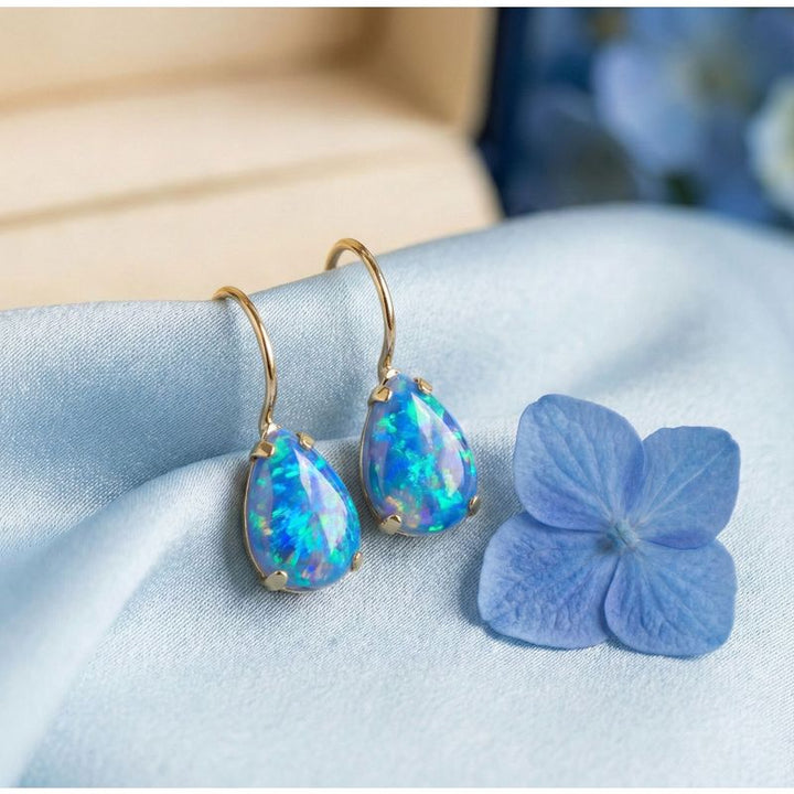 עגילי זהב 14 קראט טיפה אבן אופל כחול