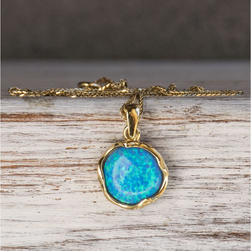 תליון מעוטר במסגרת זהב 14 קראט אבן אופל כחול