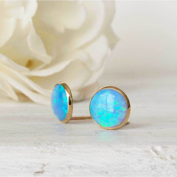 עגילי זהב 14 קראט צמודים אבן אופל כחול