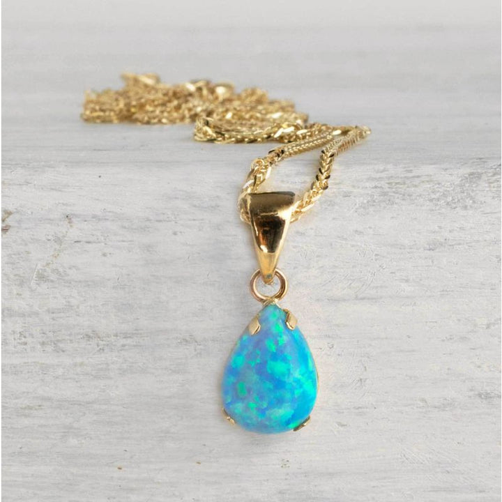 14K Yellow Gold 7x10mm Blue Opal Drop Pendant