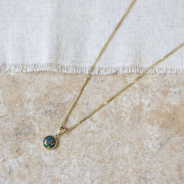 תליון זהב צהוב אופל שחור עגול