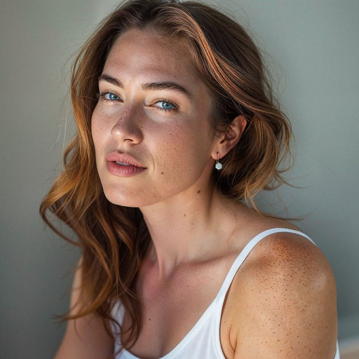 עגילים תלויים ציפוי זהב אבן טופז כחול