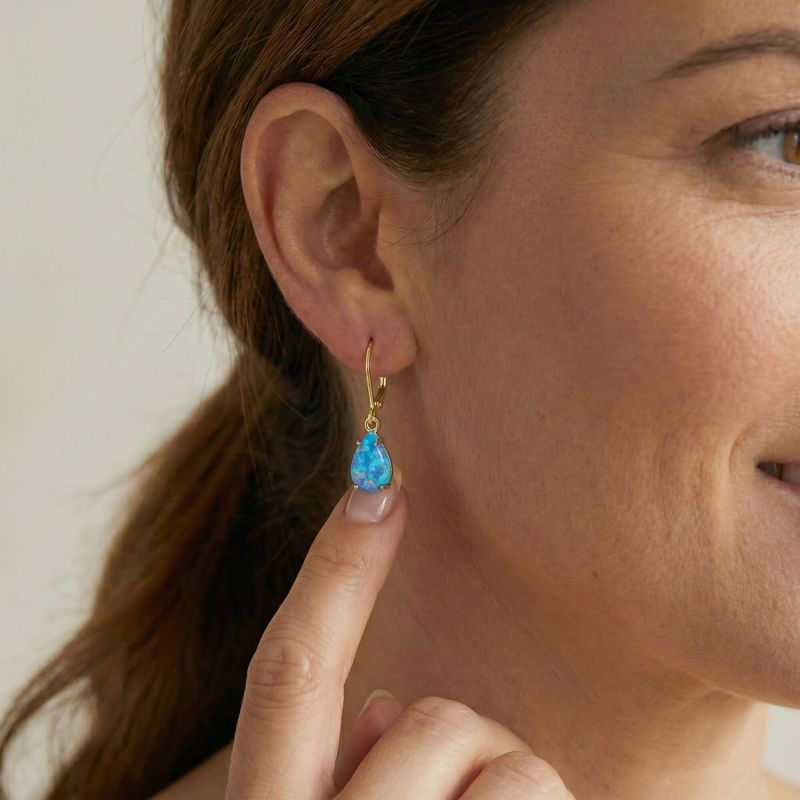 Позолоченные серьги-подвески для барбекю с вставкой из голубого опала.